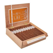 Load image into Gallery viewer, Coffee-infused Rocky Patel LB1 Churchill Shaggy cigar with textured wrapper and band, displayed on a wooden surface.