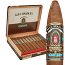 Alec Bradley Prensado Torpedo medium-flavored cigar with dark wrapper and tapered head, resting on a wooden surface.