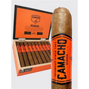 Sweet flavored Camacho Nicaragua Robusto cigar with a dark wrapper and branded band, displayed on a wooden surface.