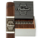 Full-flavored CAO Flathead V554 Camshaft cigar, robust and rich, displayed with other premium cigars in a cigar shop setting.