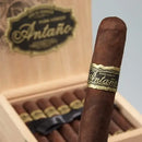 Joya de Nicaragua Antano Dark Corojo La Niveladora Toro full-flavored cigar with dark wrapper and band, resting on a wooden surface.