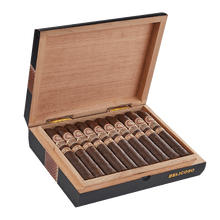 Load image into Gallery viewer, Mild flavor Rocky Patel Gold Maduro Toro Honduran cigar resting on a wooden surface, showcasing its dark Maduro wrapper.
