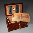 Royal Tradition Cigar Humidor from Boston's Cigar Shop, wooden box with brass accents, designed to store and preserve cigars.